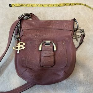 B Makowsky Pink Or Dusty Rose colored leather bag with silver hardware.